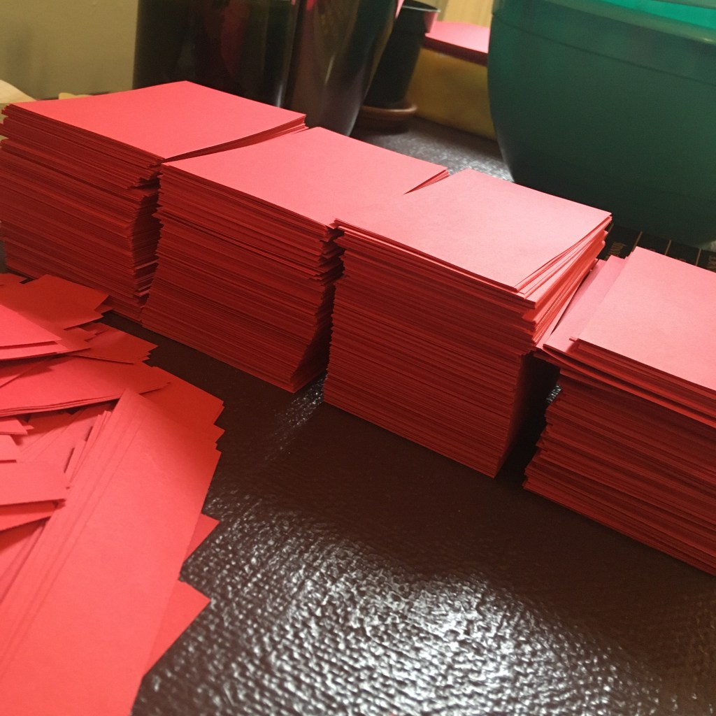 Stacks of red pre-cut paper